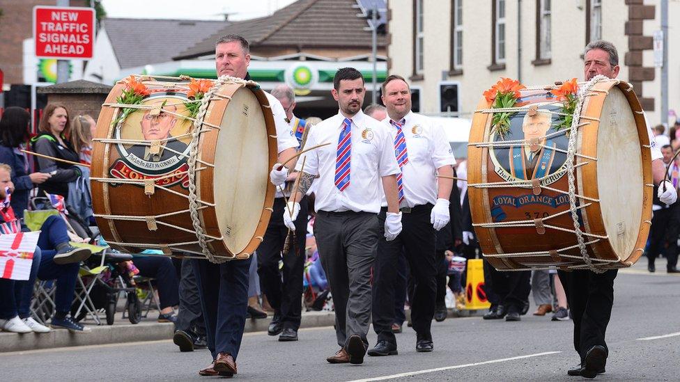 Orangemen playing lambeg drums at the Twelfth parade in Ballyclare