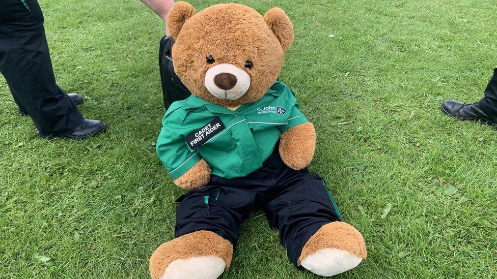 A large teddy bear in a paramedic outfit at the picnic at Féile an Phobail