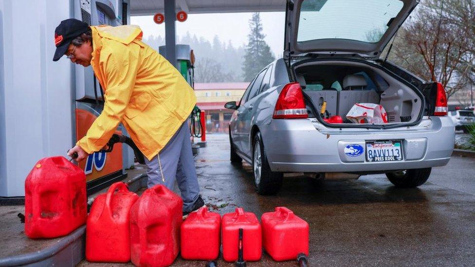 A man stockpiling gasoline