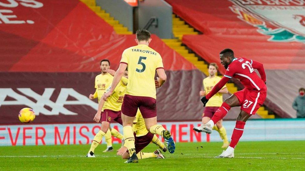 Liverpool's Belgium striker Divock Origi shoots during the English Premier League football match between Liverpool and Burnley at Anfield in Liverpool.