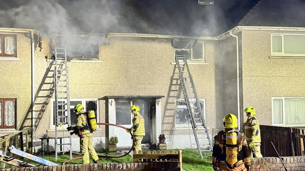 Firefighters outside a Llanelli house fire