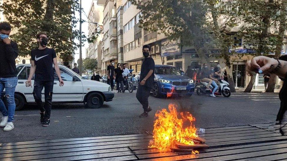 Protesters clash with police during a protest over the death of young woman Mahsa Amini in Tehran, Iran, on 8 October 2022