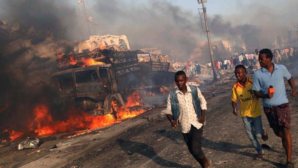 Image shows civilians evacuating from the scene of an explosion in the Hodan district of Mogadishu, Somalia on 14 October 2017