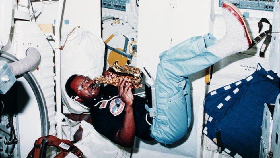 Ronald McNair playing a saxophone