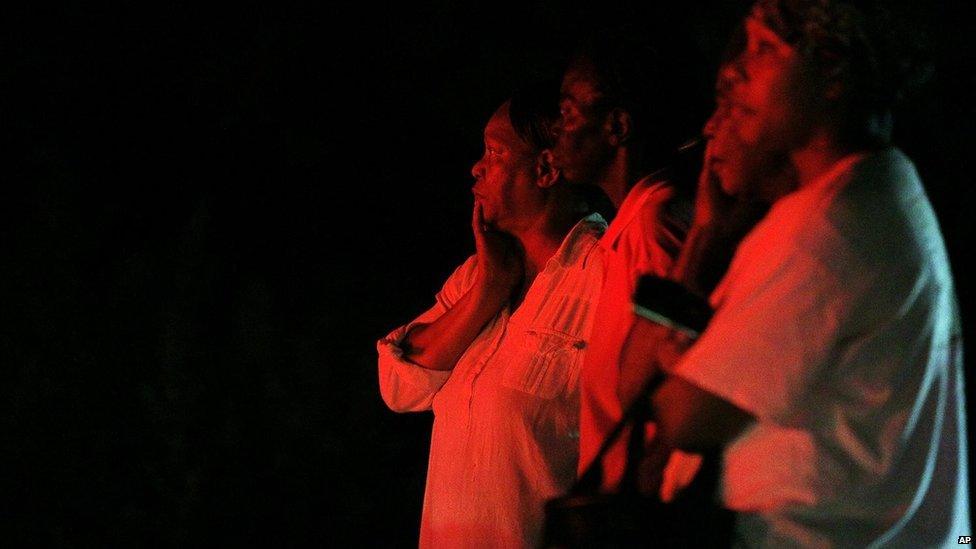 Bystanders watch as fire-fighters work at Mount Zion African Methodist Episcopal church on 30 June in Greeleyville, South Carolina