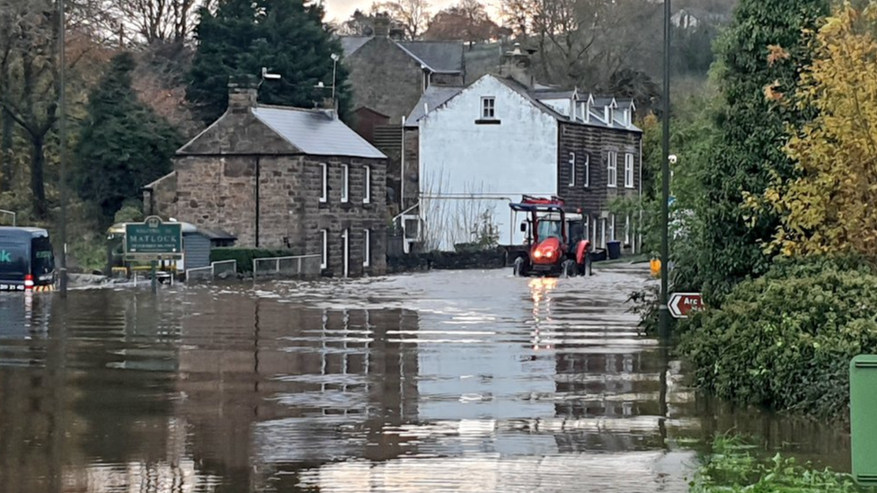 Tractor through flood water