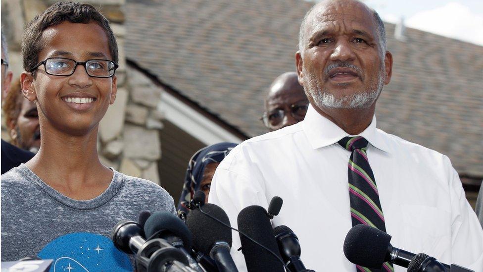 Ahmed Mohamed, 14, left, and his father, Mohamed Elhassan Mohamed, thank supporters during a news conference at their home, Wednesday, Sept. 16, 2015, in Irving, Texas. Ahmed was arrested Monday after a teacher thought a homemade clock he built was a bomb. (AP Photo/Brandon Wade)