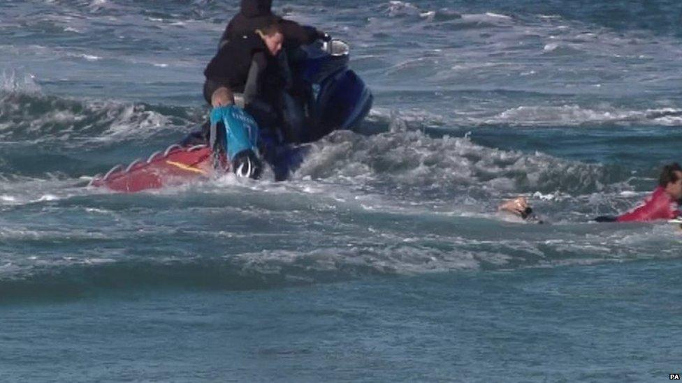 Screen grabbed image taken from footage issued by the World Surf League (WSL) of Australian surfer Mick Fanning being rescued in Jeffrey's Bay (19 July 2015)