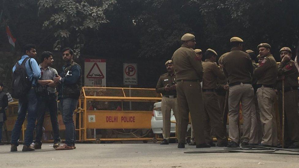 Delhi police near the entrance to the university