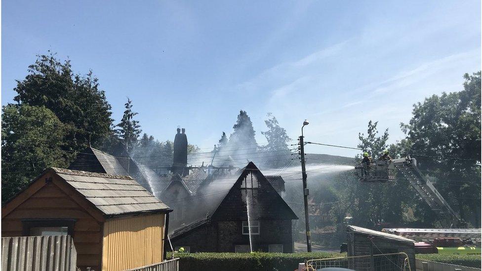 Firefighters extinguish a blaze at Dolgerddon Hall, Rhayader