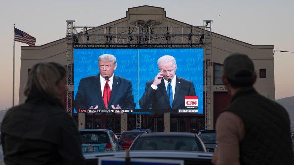 Viewers watch a 2020 presidential debate between Joe Biden and Donald Trump. The two will likely face off again in the 2024 US presidential election.