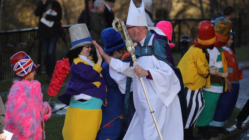 The Diddymen get high fives from the Bishop of Liverpool Paul Bayes