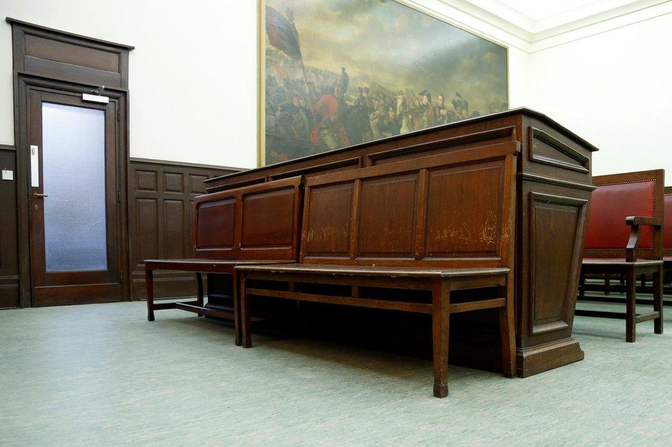 View of defendant's bench in a courtroom ahead of the trial of Salah Abdeslam, one of the suspects in the 2015 Islamic State attacks in Paris, at Brussels Palace of Justice, Belgium, 30 January