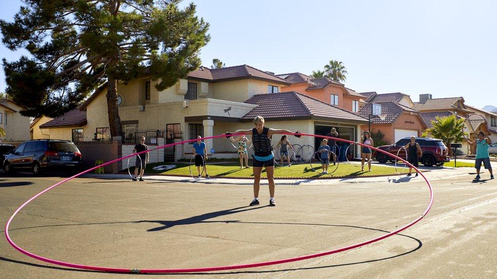 Getti-Kehayoa spinning a 17ft titanium hula hoop.