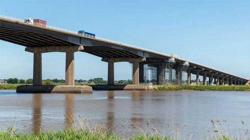 Side view of the bridge showing scaffolding by the central spans