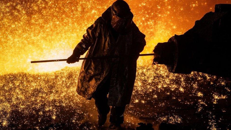 Cast House operator Martin Rees changes the nozzle on a clay gun in Blast Furnace number four at the Tata Steel Port Talbot integrated iron and steel works in south Wales, 15 August, 2023.