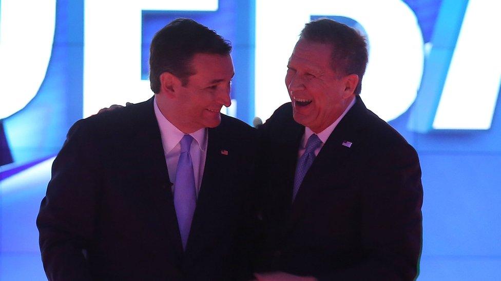 Ted Cruz and John Kasich laugh during a Republican debate.