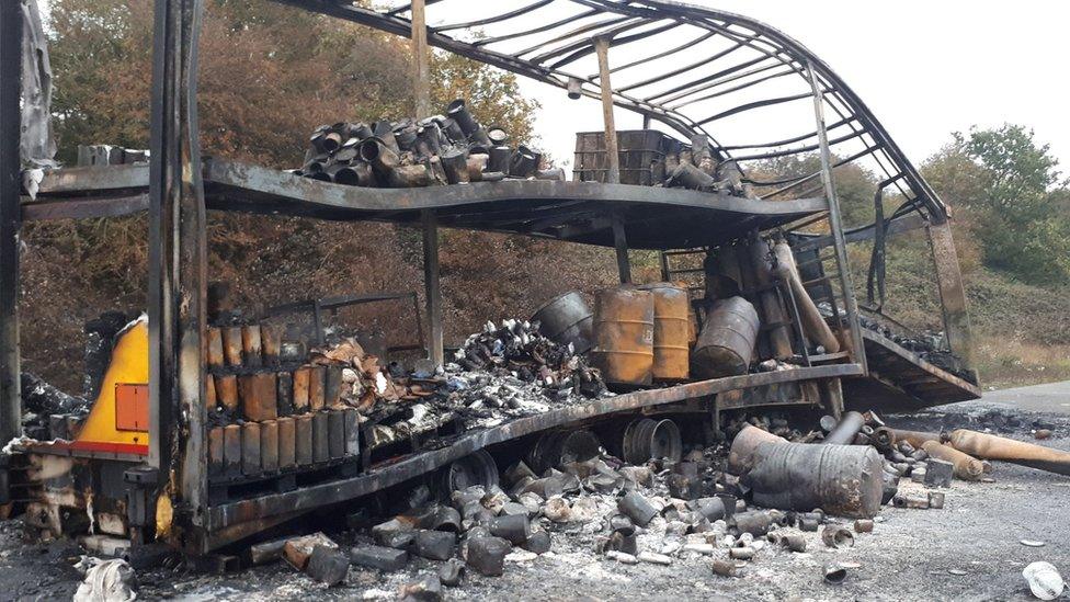 The burned out lorry and trailer