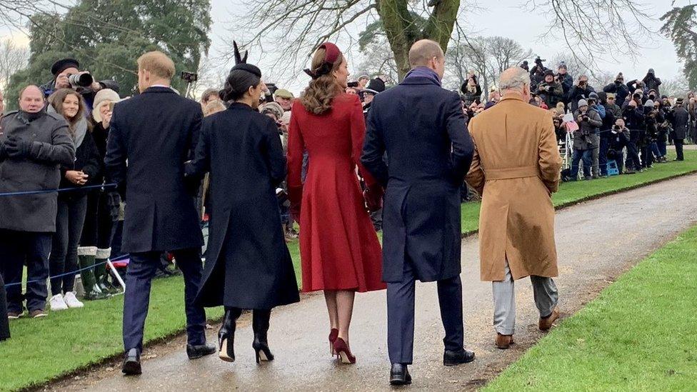 Royal family walking away from church