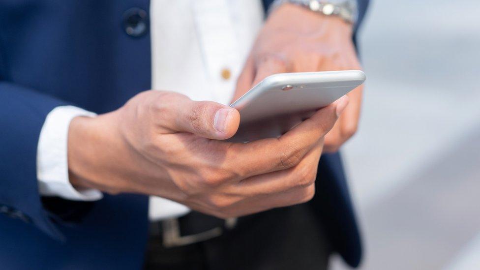 Man holding mobile phone