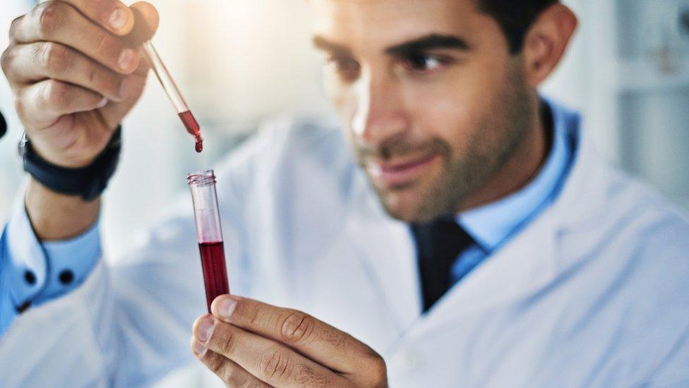 Lab worker testing a blood sample