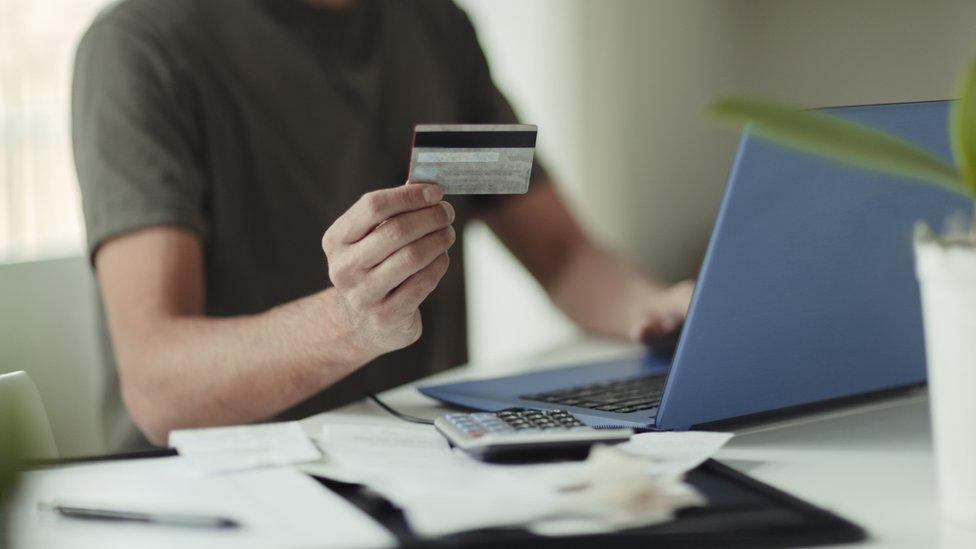 Man holding a credit card