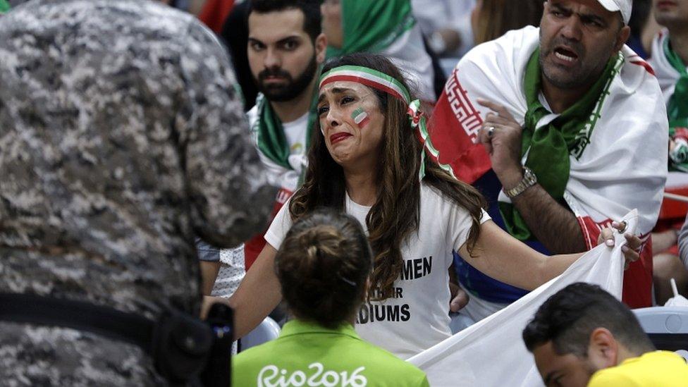 Darya Safai cries as she is asked to drop her protest sign (13 August 2016)