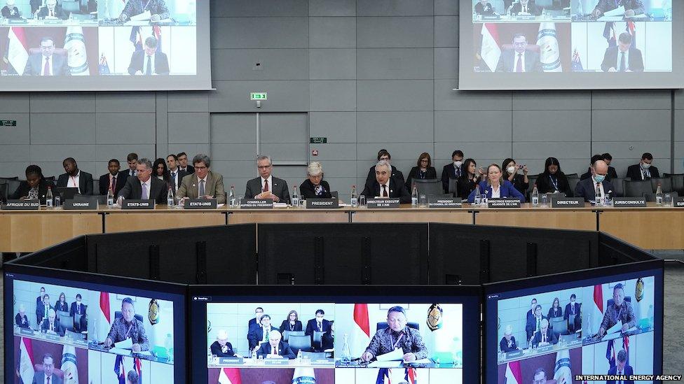 ministers around a table are joined by those on video links