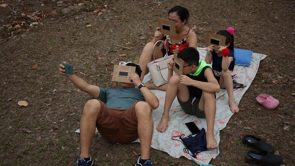 A family watching the eclipse in Manaus, Brazil.