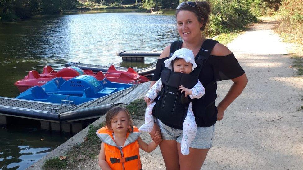 Angharad Carrington-Edmunds with her children by the pedal boats