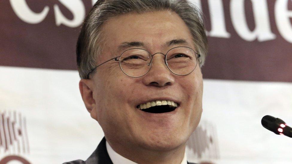 In this 15 Dec 2016 file photo, possible South Korean presidential contender Moon Jae-in laughs during a press conference at the Seoul Foreign Correspondents Club in Seoul, South Korea