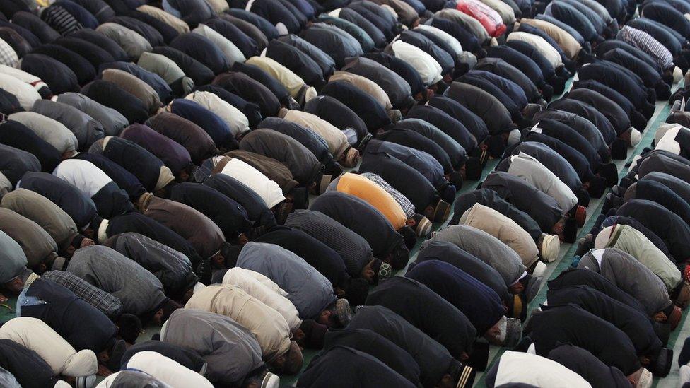 Muslims pray at a mosque in London