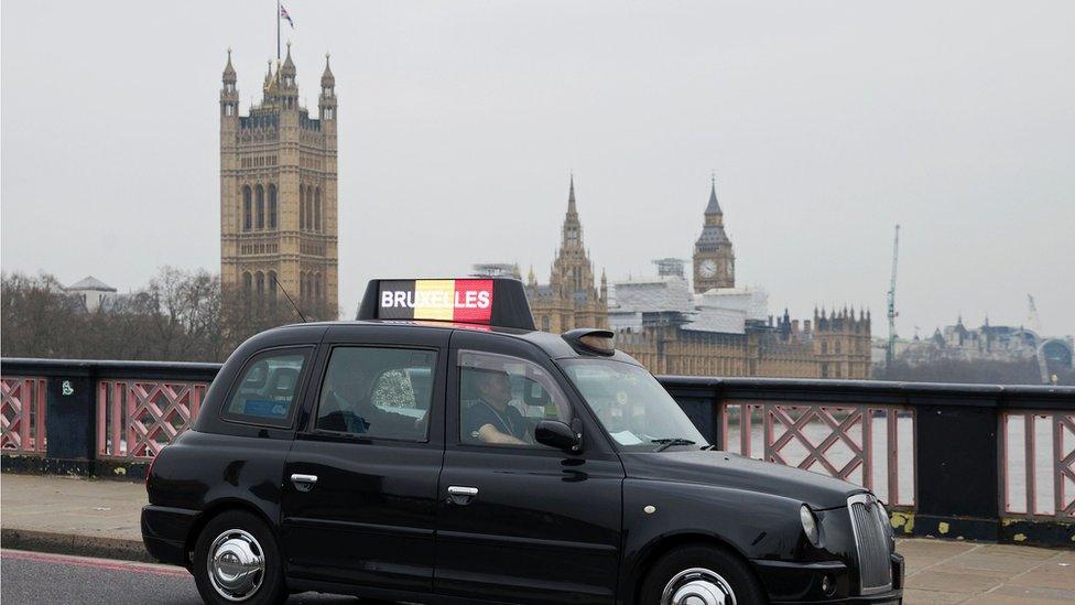 London taxi displaying Belgian flag