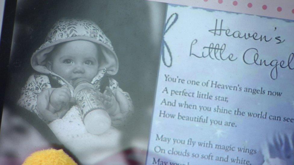 A photo of Ali Jayden Doyle left among floral tributes outside the house in which she was injured