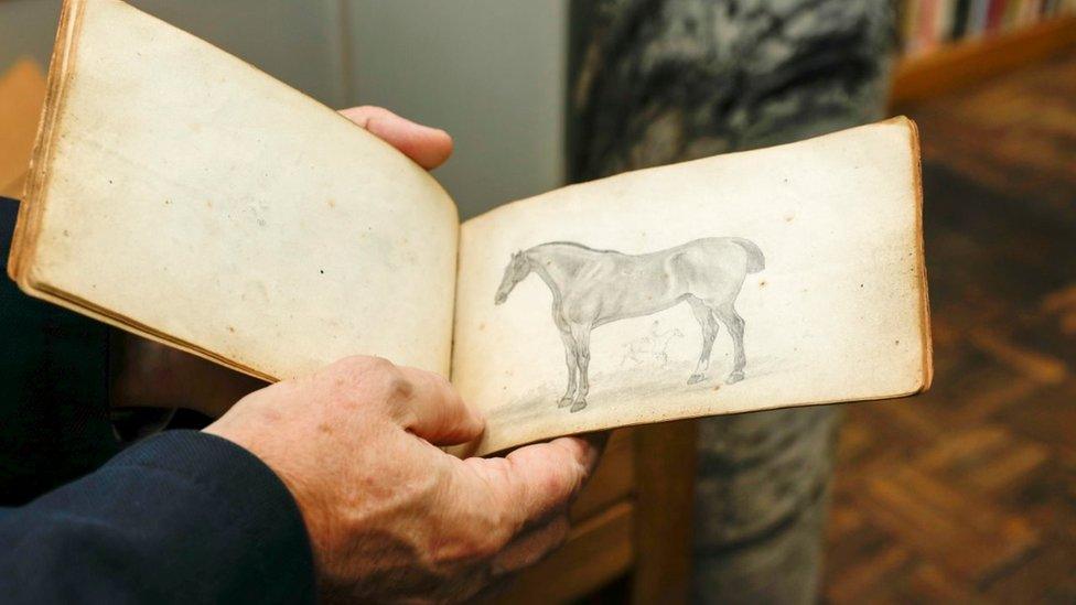 Sketch of horse in book