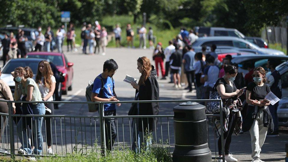 People queuing to go into Belmont Health Centre in Harrow which is offering a first dose of Pfizer coronavirus vaccine to anyone aged over 18 on Saturday and Sunday who is living or working in Harrow.