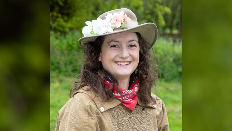 Laura Cohen wearing a hat