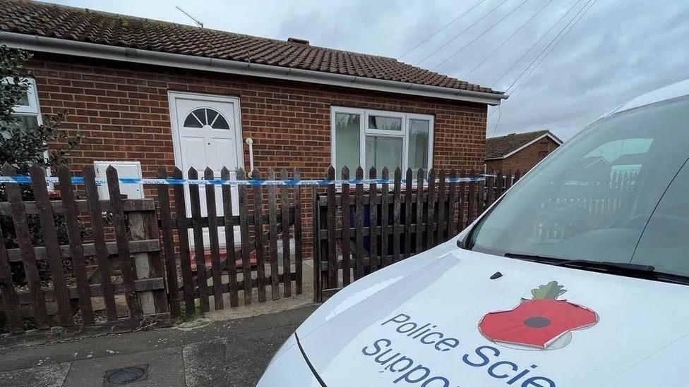 Police van outside house