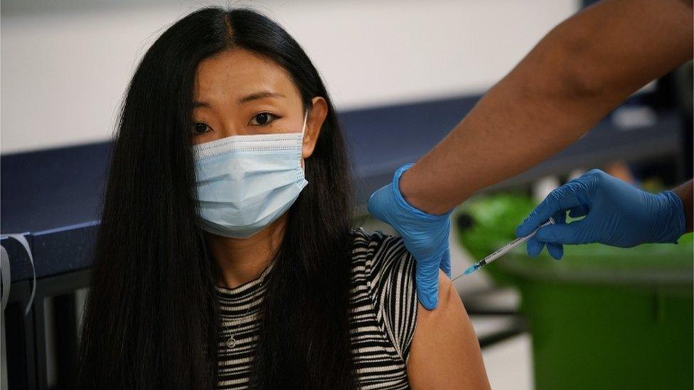 A woman getting vaccinated