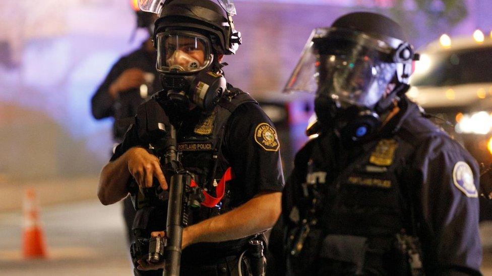 Police confront demonstrators as Black Lives Matter supporters demonstrate in Portland, Oregon on July 4, 2020