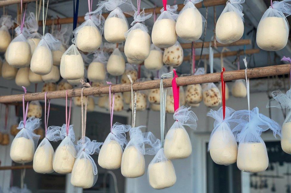 Malathouni cheeses hanging outside Angela Rouggeri’s workshop