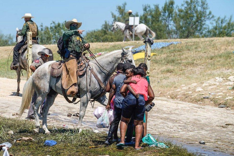 A US Border Patrol agent on horseback tries to stop Haitian migrants from entering an encampment on the banks of the Rio Grande near the Acuna Del Rio International Bridge in Del Rio, Texas, on 19 September 2021