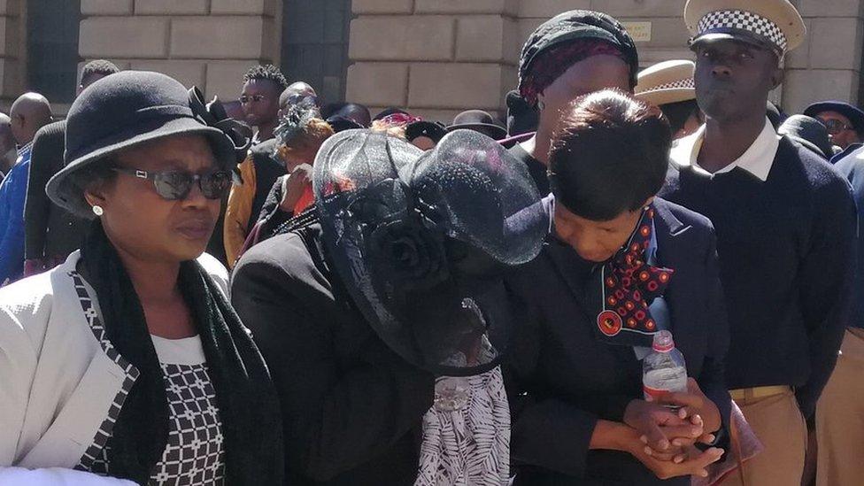 Mourners at the wreath-laying ceremony