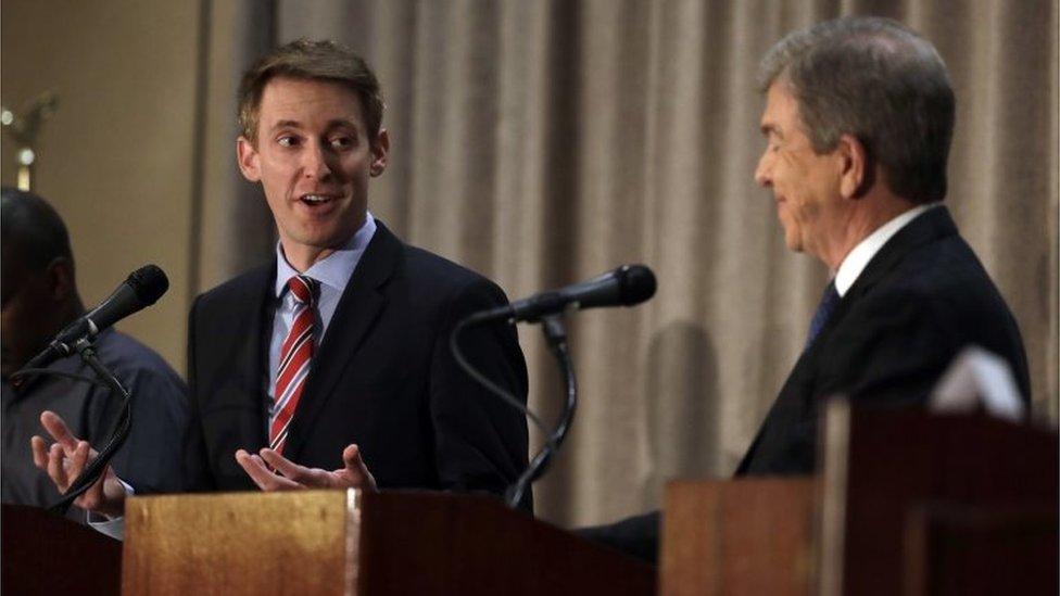 Democratic challenger Jason Kander (L) speaks to Republican incumbent Senator Roy Blunt (R) during the first general election debate in Missouri.