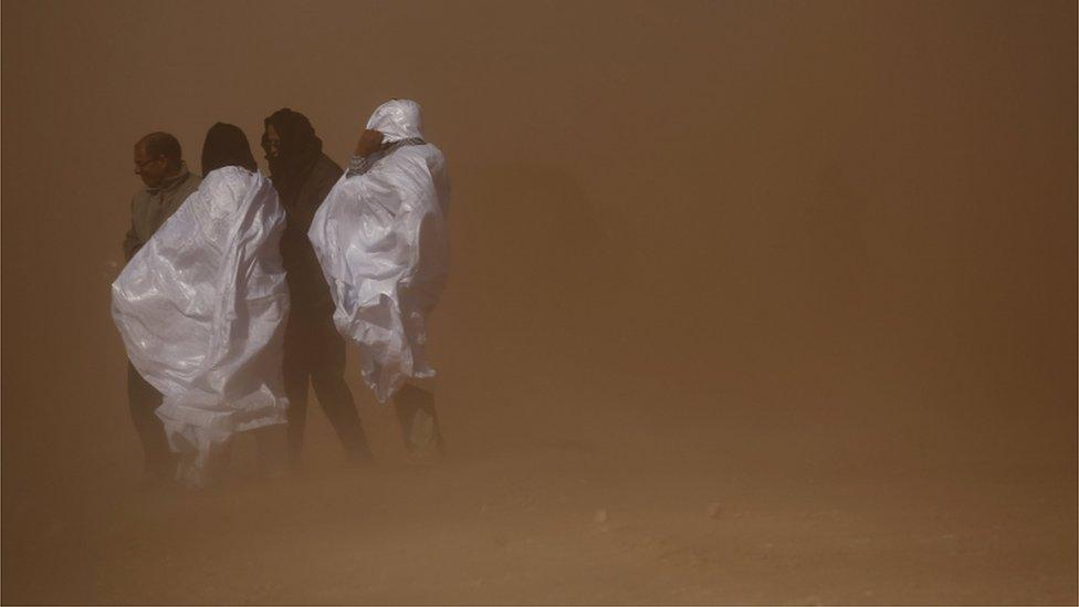 Indigenous Sahrawi officials are seen as the helicopter of U.N. Secretary General Ban Ki-moon lands in the Sahrawi refugee camp of Al Smara in Tindouf southern Algeria March 5, 2016.