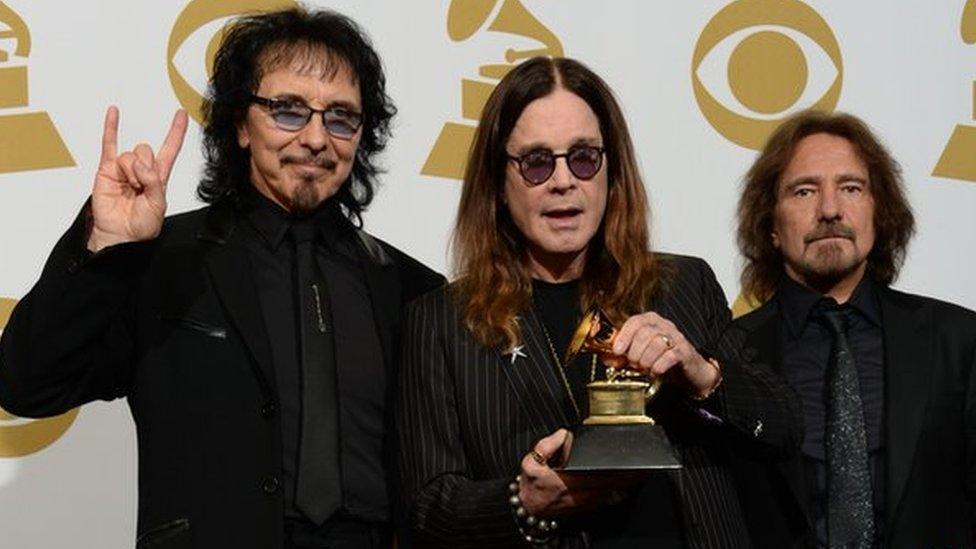 Tony Iommi with Ozzy Osbourne and Geezer Butler of Black Sabbath