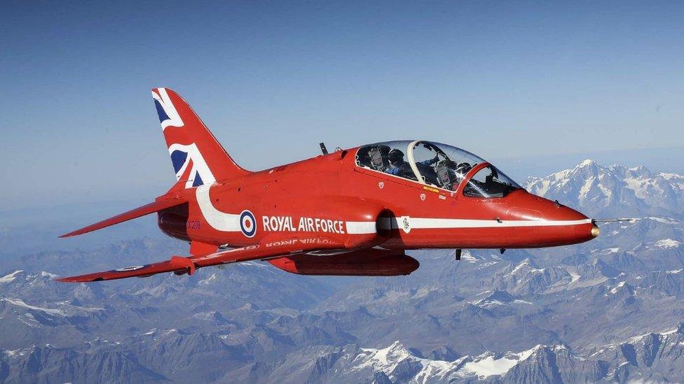 Red Arrows jet flying over the Alps