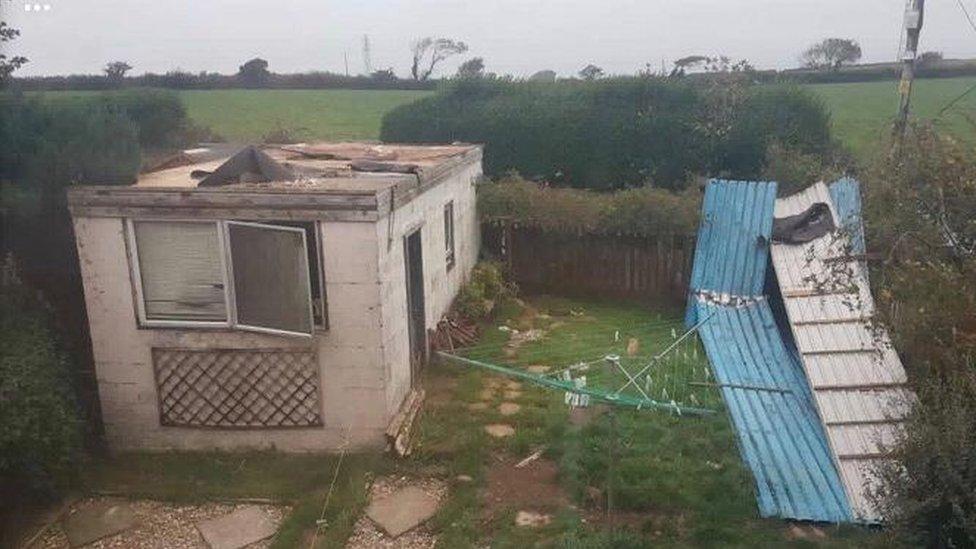 garage with roof torn off