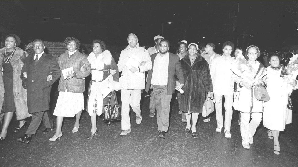 People at a protest in the 1980s