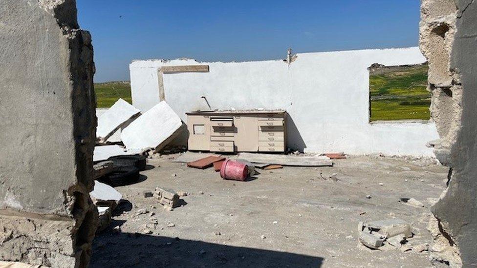 View of destroyed house in Zanuta village